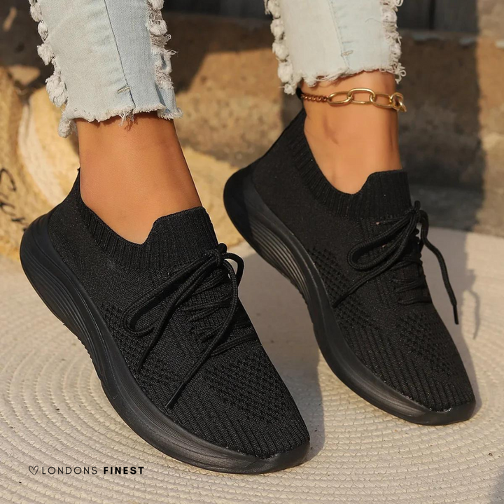 White women's supportive walking sneakers, breathable, ergonomic design for all-day comfort & active lifestyle.