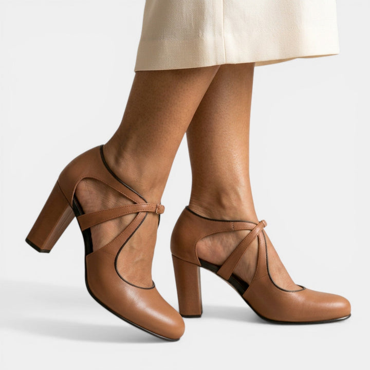 Women's T-Strap high heel sandals with buckle closure and round toe for elegant evening wear.