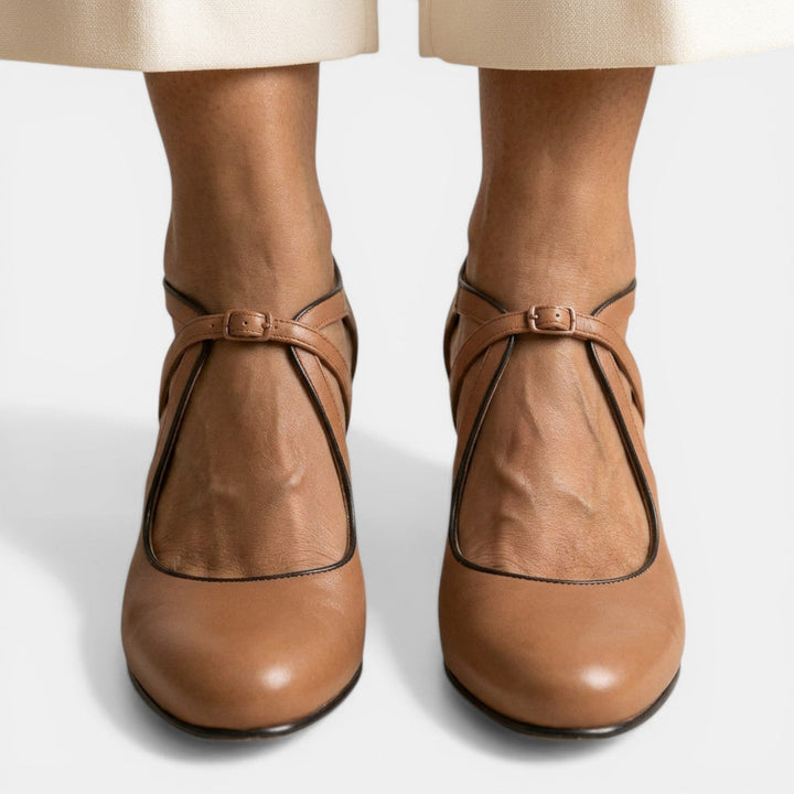 Chic women's T-Strap high heels, featuring a round toe & secure buckle closure, perfect for dressy occasions.