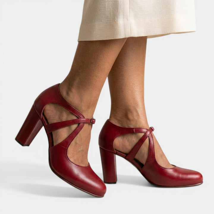 Elegant women's T-Strap high heel sandals, ideal for evening wear & special events. Features round toe & buckle.