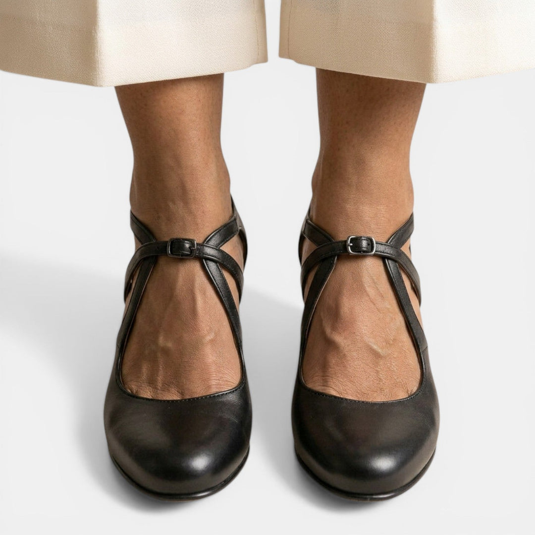 Classic women's T-Strap high heel sandals. Round toe design with adjustable buckle for secure & elegant fit.