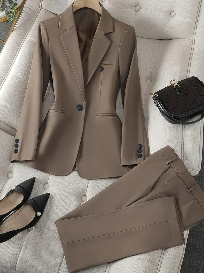 Women's tailored blazer & slim trousers set with notched lapel, perfect for professional office wear.