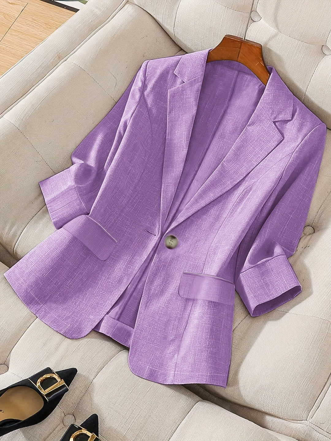 Women's tailored cropped blazer for business casual; sophisticated office wear.