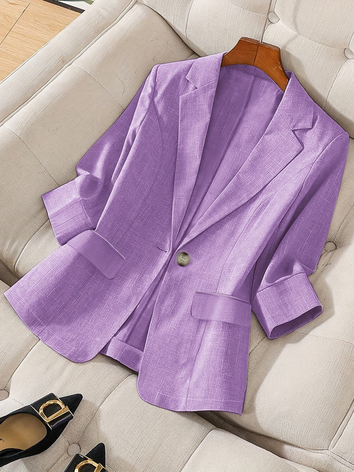 Women's tailored cropped blazer for business casual; sophisticated office wear.