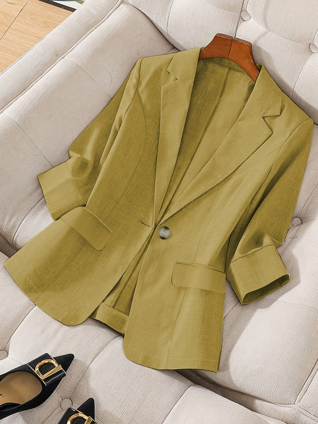 Elegant women's tailored cropped blazer; sophisticated workwear & light layering.