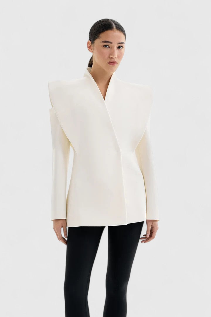 Women's tailored ivory blazer with structured shoulders, sleek and elegant for office or evening wear.