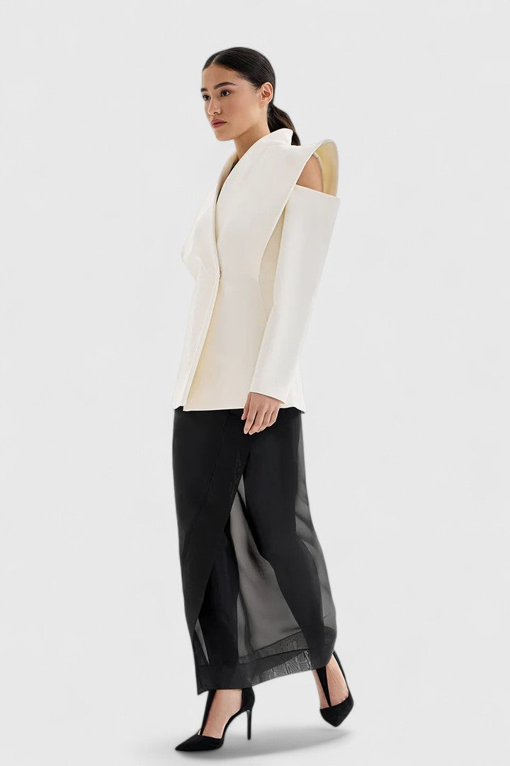 Sleek ivory tailored blazer for women, featuring structured shoulders and an open front, perfect for power dressing.