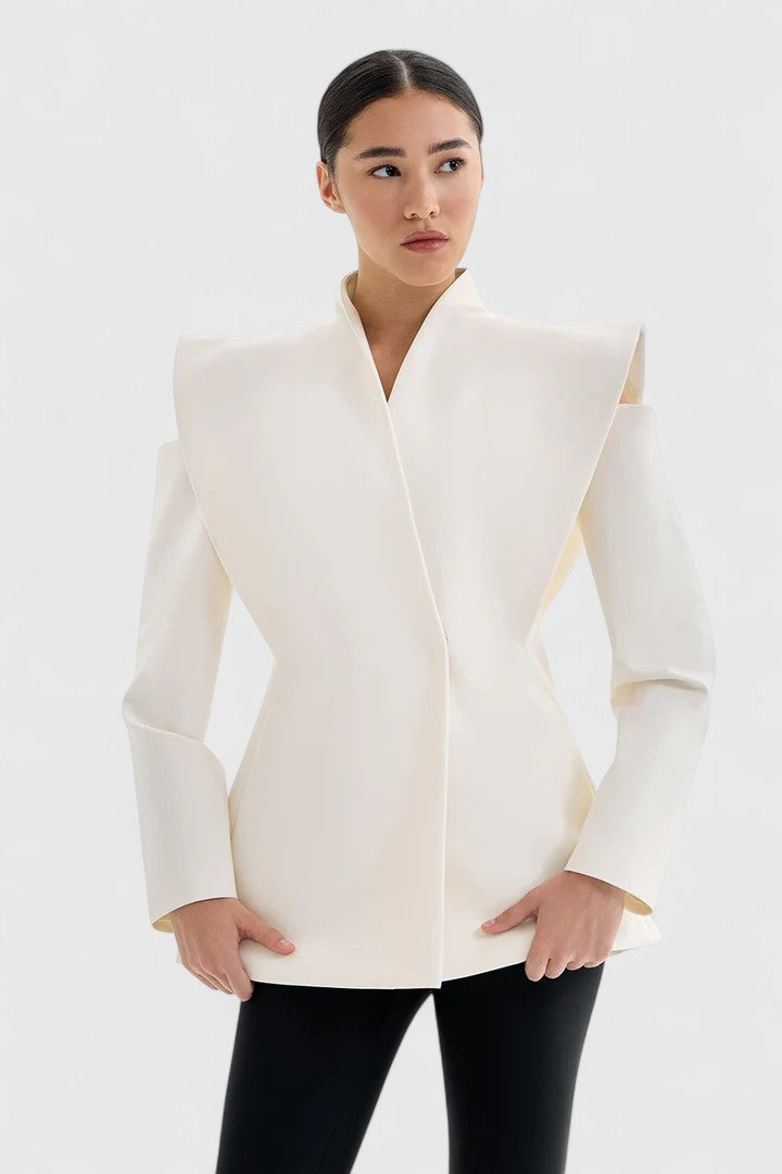 Elegant women's white blazer with structured shoulders, a sophisticated statement piece for modern office attire.
