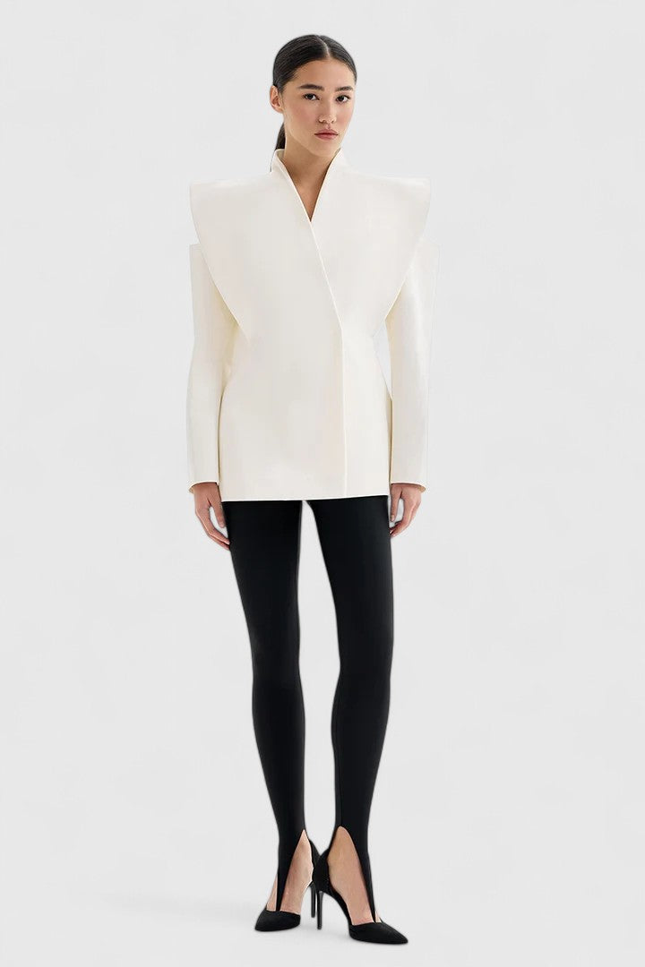 Power dressing women's ivory tailored blazer with structured shoulders, a sleek and elegant modern fashion statement.