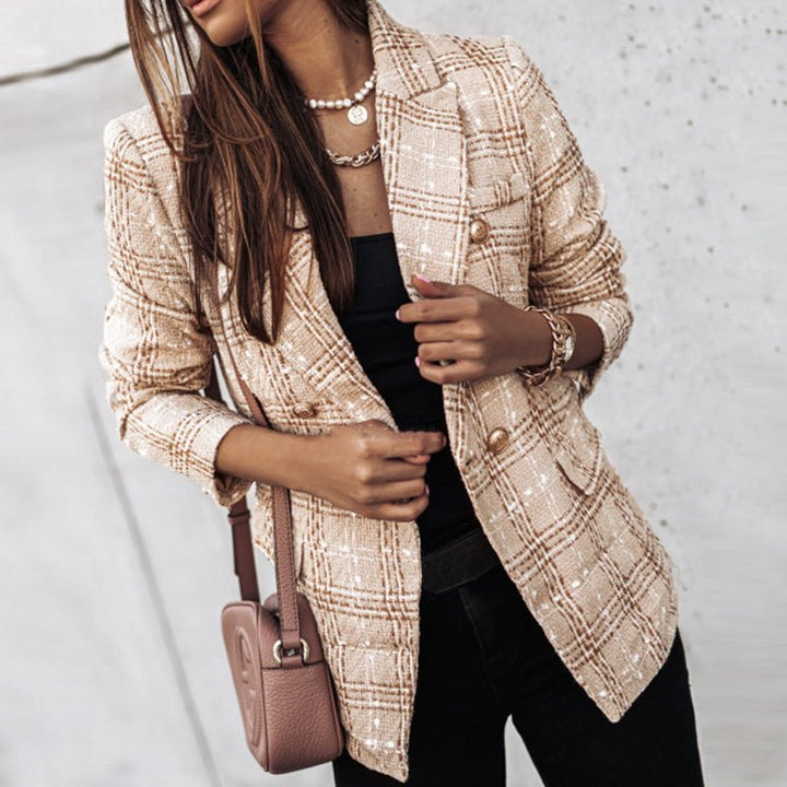 Chic women's double-breasted plaid blazer with elegant gold buttons, ideal for smart casual or office style.