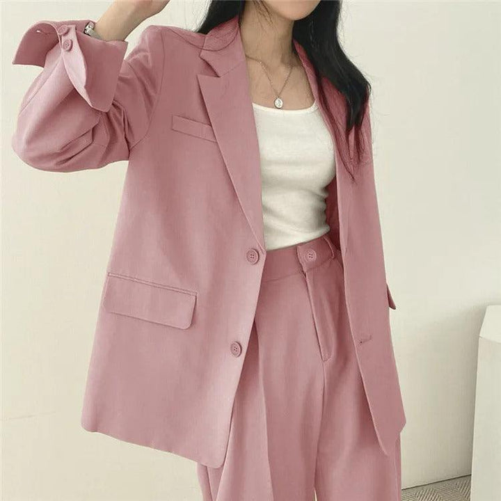 Elegant women's tailored suit set with a long blazer, designed for a sharp business look.
