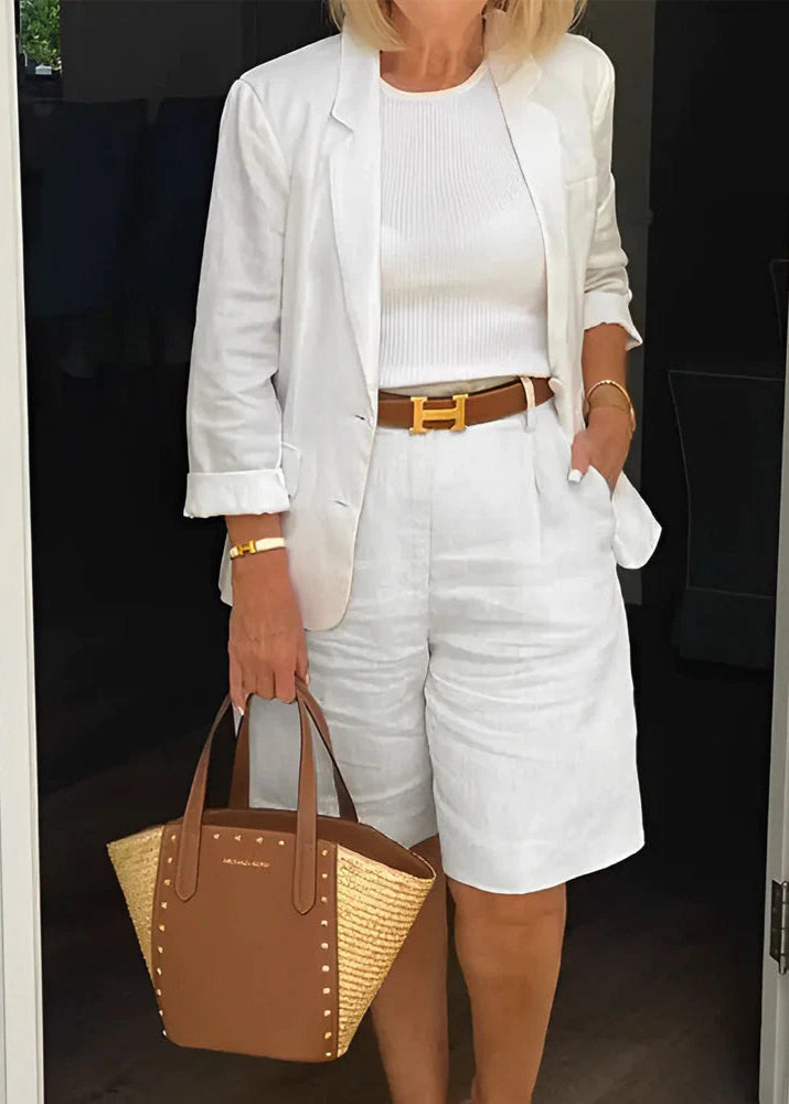 Women's tailored two-piece set featuring a chic blazer and knee-length shorts, perfect for smart casual summer fashion.