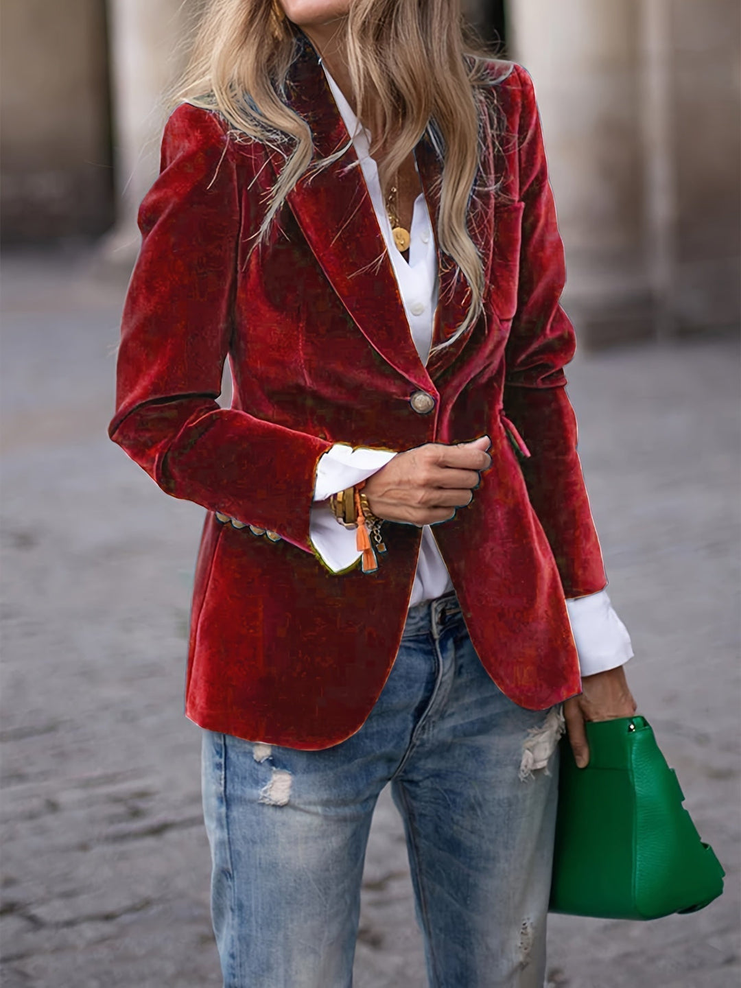 Women's tailored velvet blazer with elegant gold buttons, perfect for a chic, formal look.