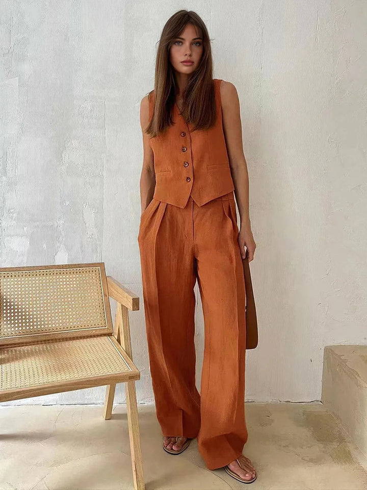 Elegant women's tailored waistcoat and wide leg pant set, ideal for sophisticated office or casual chic.