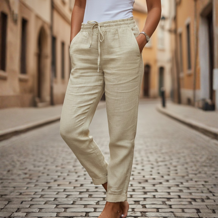 Close-up of elastic waist & functional drawstring on women's casual tapered summer pants.