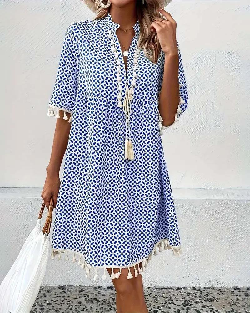 Boho chic printed mini dress for women with V-neck and tassel trim. Ideal for summer days & beach.