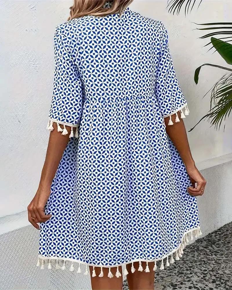 Relaxed fit women's summer mini dress, short sleeve, tassel trim. Perfect casual day dress or beachwear.