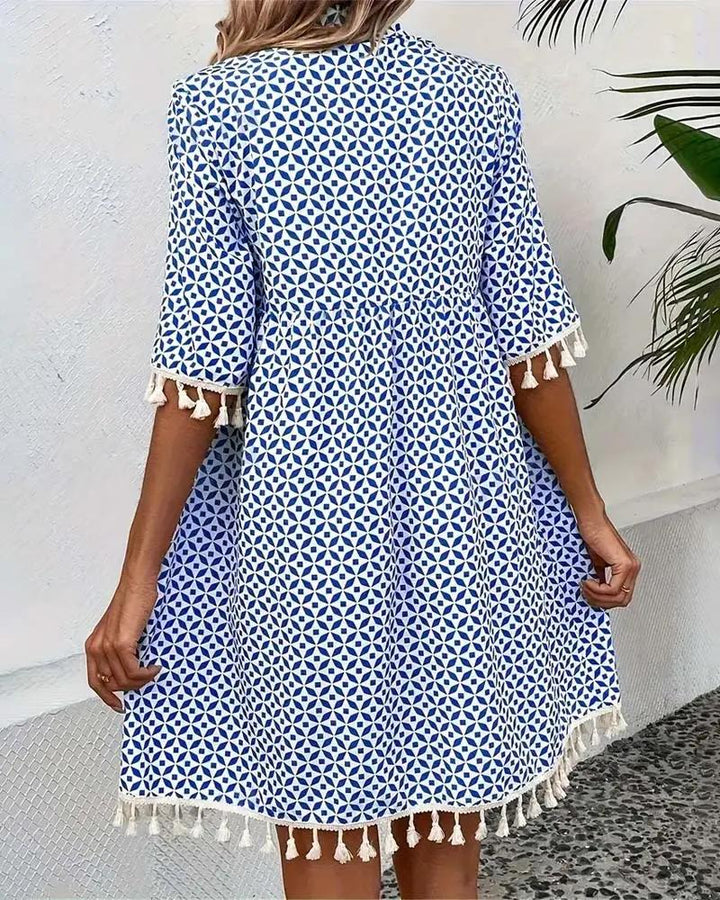 Relaxed fit women's summer mini dress, short sleeve, tassel trim. Perfect casual day dress or beachwear.
