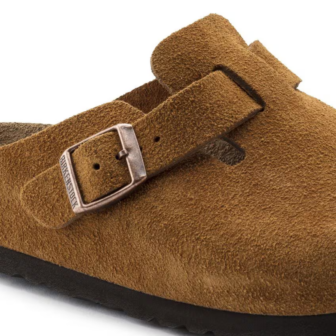 Taupe women's clogs showing detail of comfortable design & cushioned anatomical footbed for support.