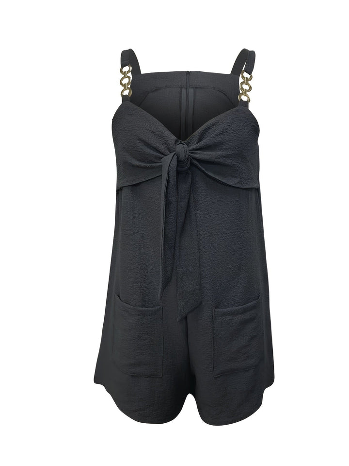 Fashionable women's short romper, textured fabric, flattering sweetheart neck, with chain straps.