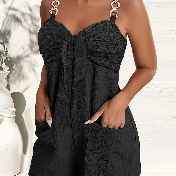 Chic women's textured romper, sweetheart neck, elegant chain straps, ideal for any summer outing.