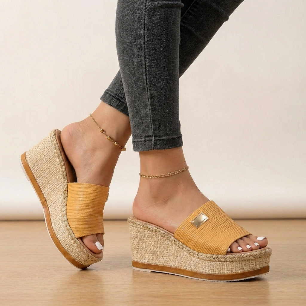 Stylish women's open-toe espadrille wedge sandals with textured straps, offering comfortable casual chic for summer fashion.