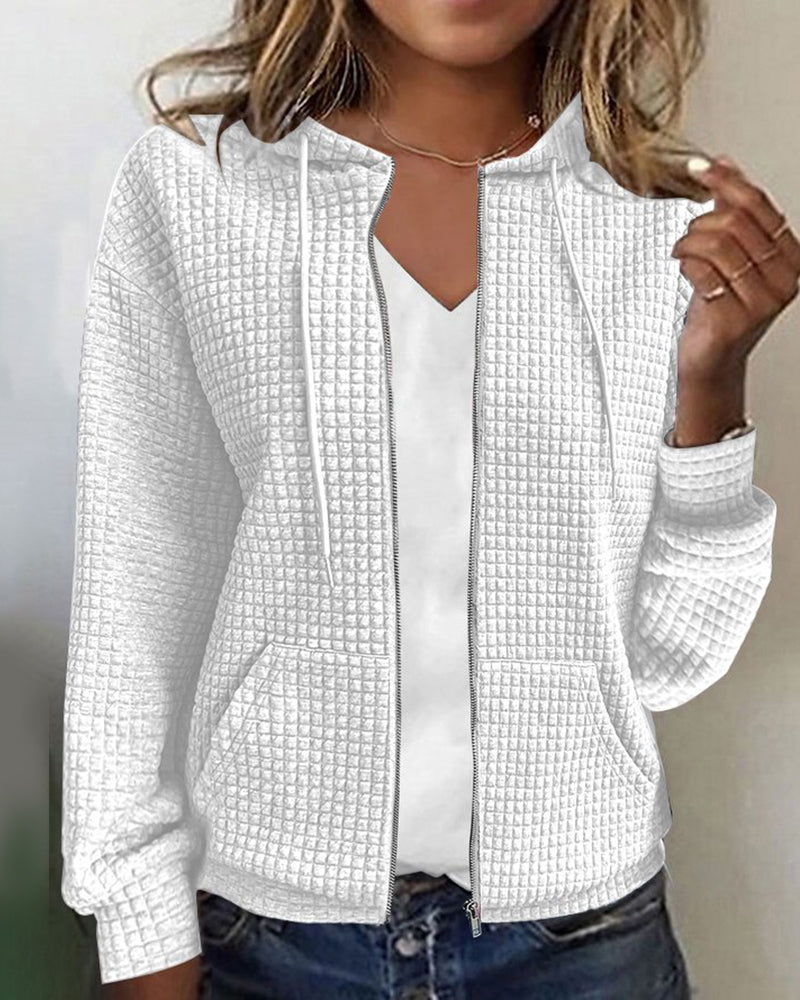 Relaxed fit women's textured zip-up hoodie jacket. Stylish, comfortable layering piece with practical front pockets.