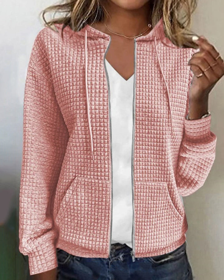 Women's everyday textured zip-up hoodie jacket. Fashionable outerwear for layering, featuring a hood & pockets.