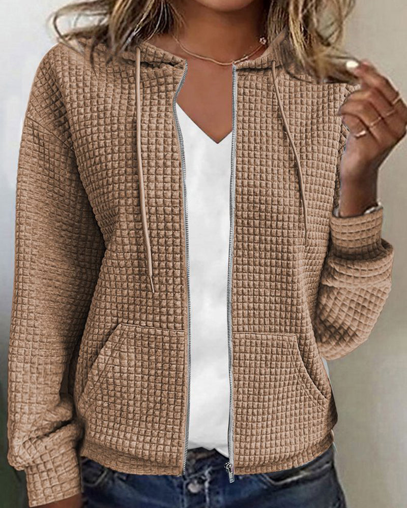 Comfortable women's textured zip-up hoodie jacket. Cozy hooded design with convenient front pockets for women's fashion.