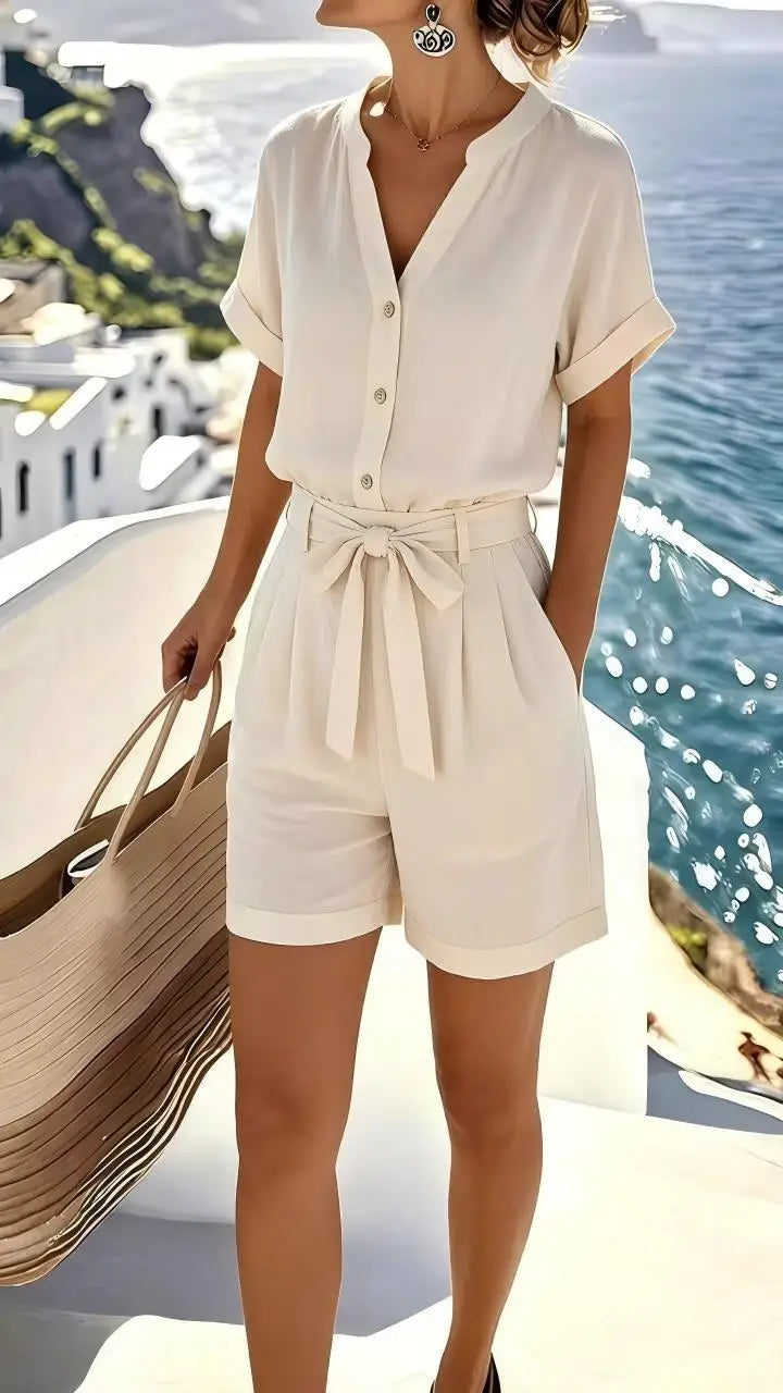 Women's tie-front summer romper, chic & comfortable, perfect for casual wear or vacation. Lightweight sleeveless design.