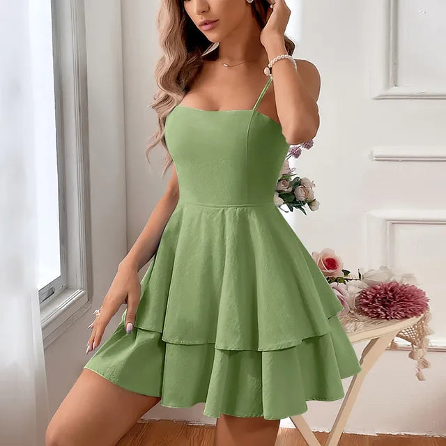 Stylish women's tiered A-line mini dress featuring thin spaghetti straps, suitable for homecoming or casual wear.