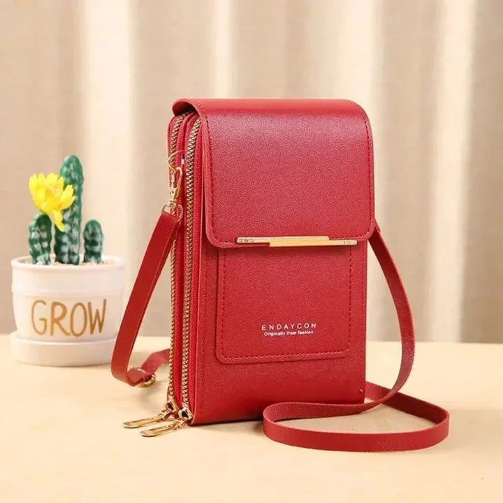 Small women's travel crossbody bag with clear touch screen for phone access. Multiple colors available.