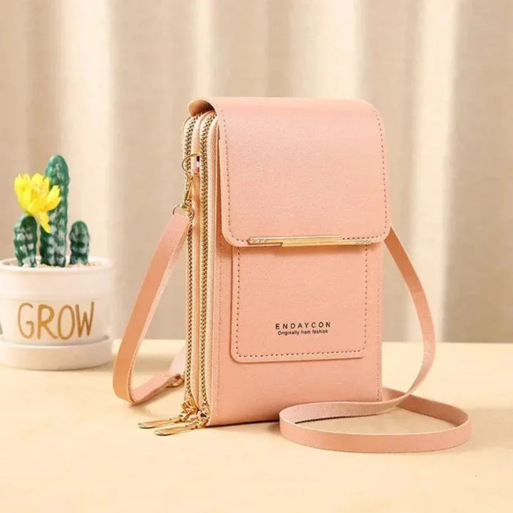 Fashionable compact hands-free phone bag for women. Securely holds your smartphone & small essentials.