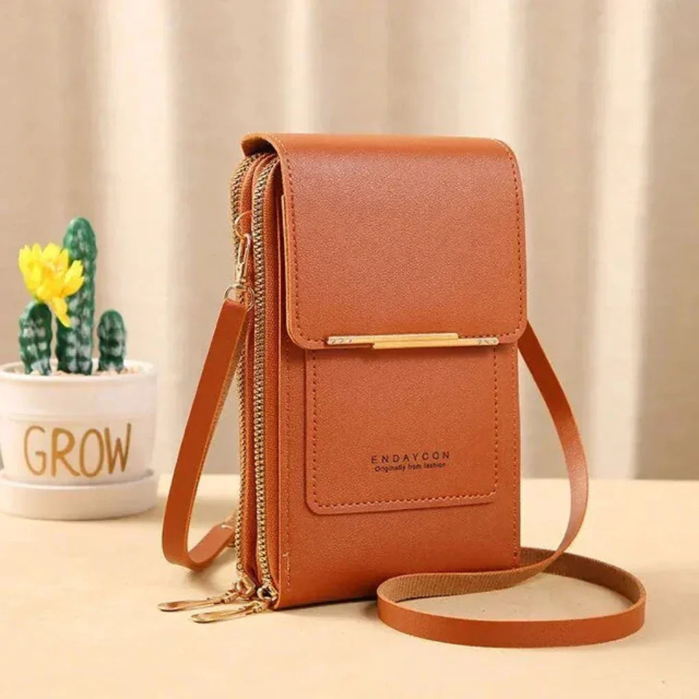 Organized women's phone cross body bag. Small, practical design with a touch screen panel for ease.