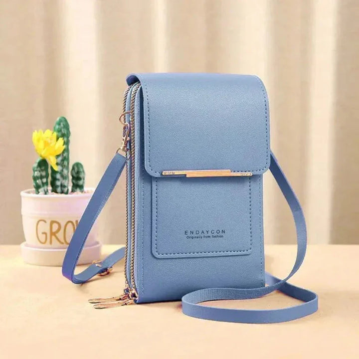 Versatile women's touch screen phone bag. A compact fashion accessory for carrying your phone & cards.