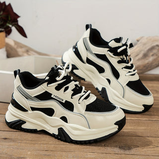 Black ladies' platform casual sneakers with a comfortable thick sole for everyday wear.
