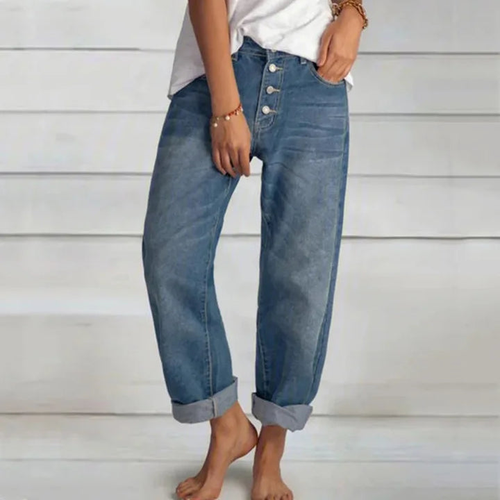 Women's trendy relaxed fit blue button-front jeans made from comfortable denim, perfect for casual wear.
