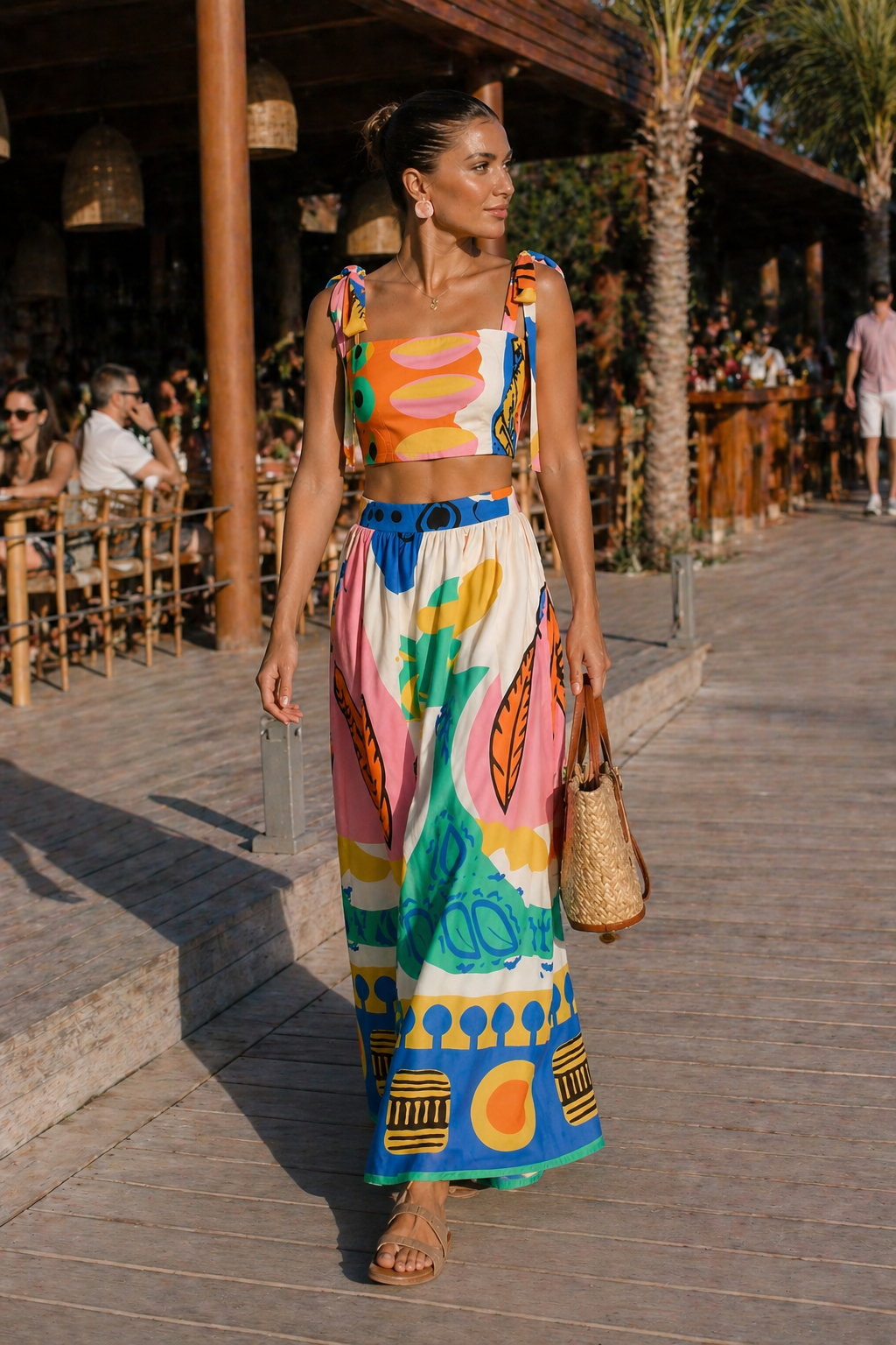 Elegant women's tropical print crop top and long flowing maxi skirt. Chic two-piece summer vacation set.