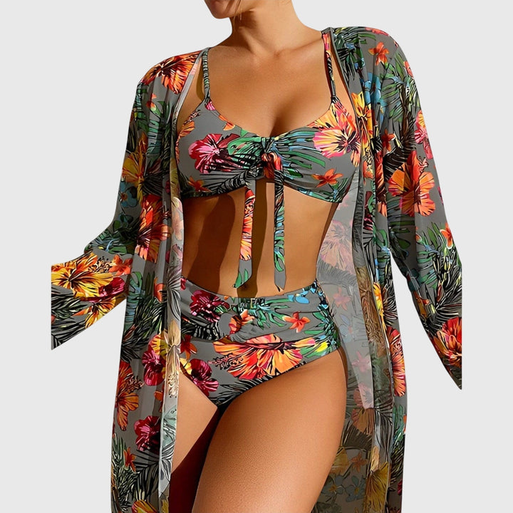 Close-up of vibrant tropical floral print on a women's flattering two-piece bikini for resort wear.