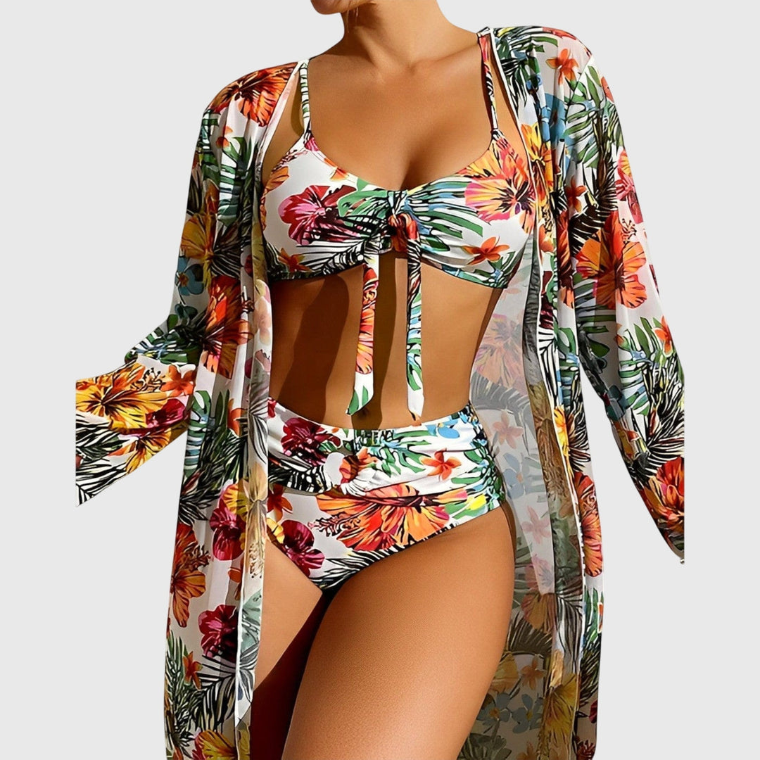 Model wearing a stylish women's tropical print two-piece bikini swimsuit by the pool. Summer fashion.