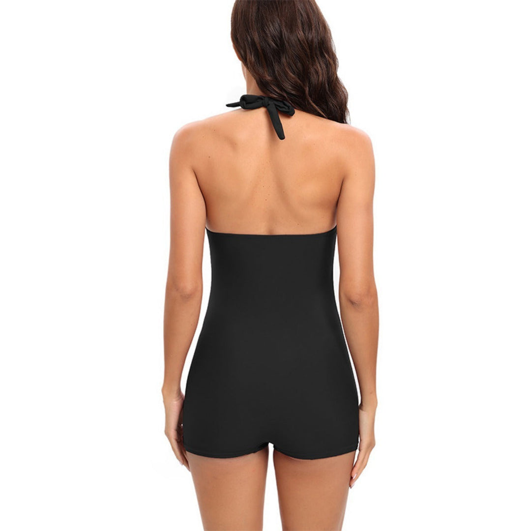 Confident women's tummy control one-piece swimsuit for elegant summer style.