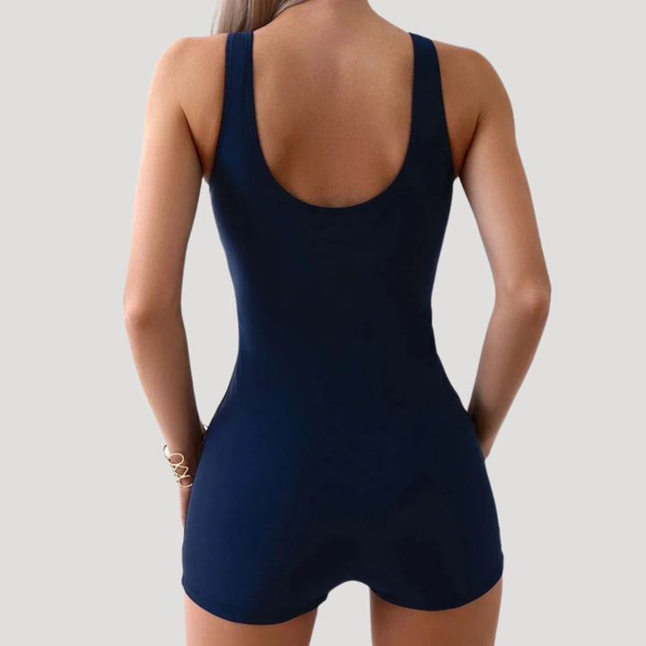 Stylish women's tummy control one-piece swimsuit, offering a sleek silhouette for beach vacations & water sports.