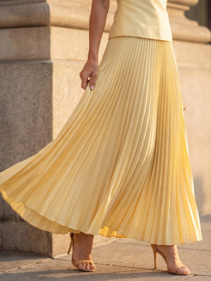 Chic women's two-piece skirt set with structured top & pleated maxi skirt. Perfect for party wear.