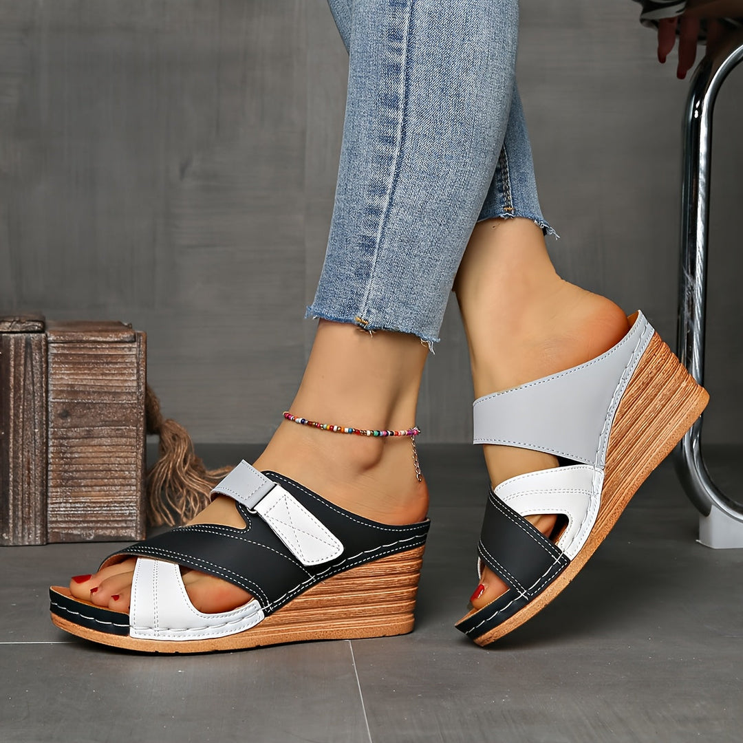 Stylish women's two-tone wedge sandals, essential summer footwear.