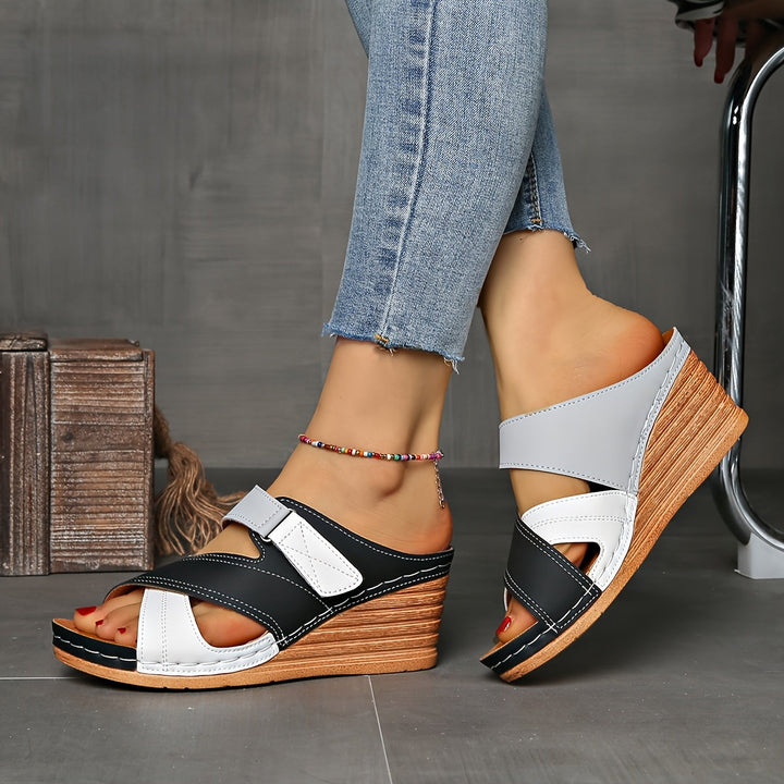 Stylish women's two-tone wedge sandals, essential summer footwear.