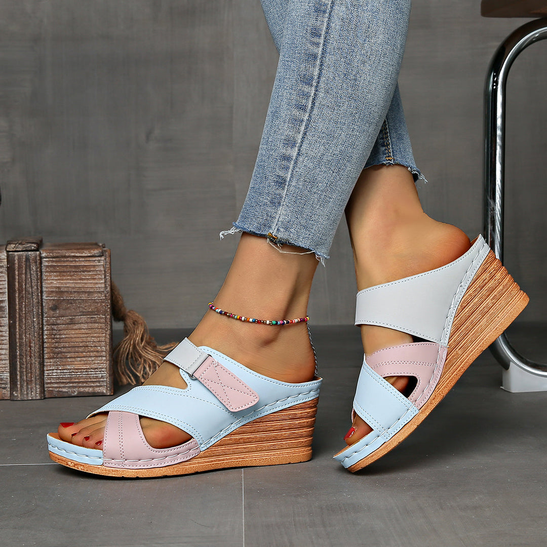 Modern two-tone wedge women's slides, great for casual summer outfits.