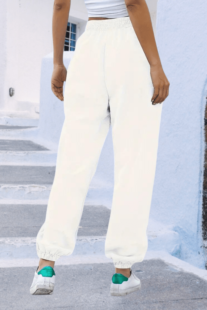 Soft women's sweatpants, high-rise joggers with elastic waist for ultimate relaxation.