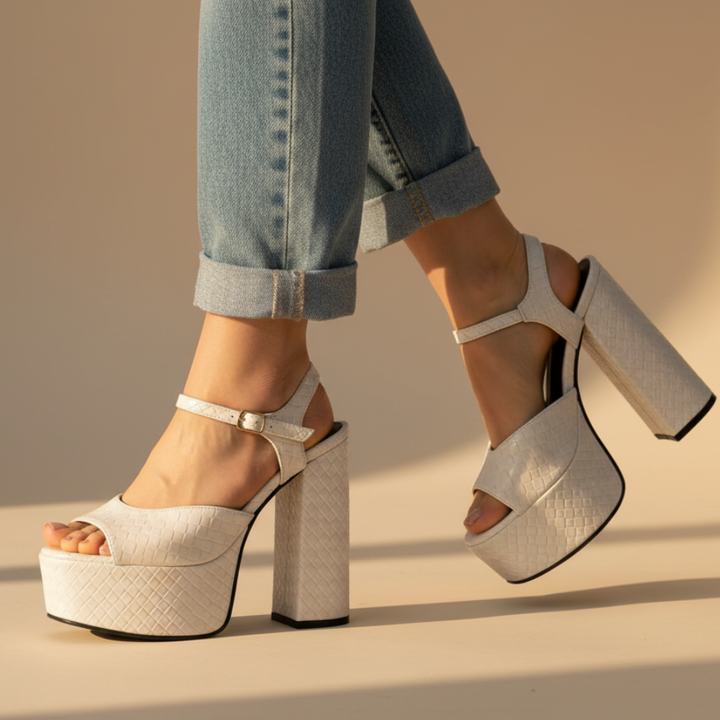 Women's ultra high block heel platform sandals with open toe & buckle strap.