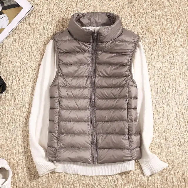 Cozy women's ultra-light down vest, soft & warm. Perfect layering piece for comfort and warmth in cold weather.