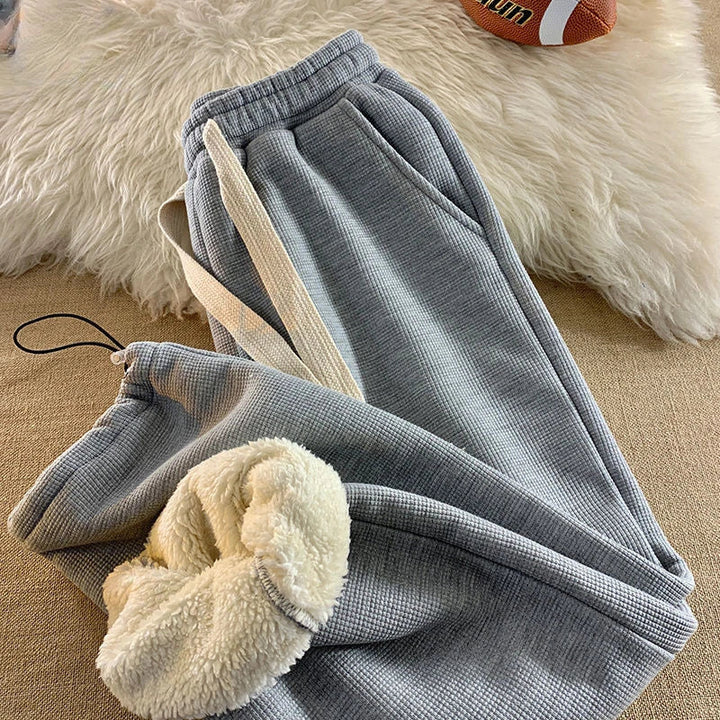 Soft, warm women's straight leg lounge pants, offering cozy winter comfort and relaxed fit for home or casual.